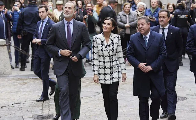 Queen Letizia wore a houndstooth blazer by Uterque, and leather slim pants by Uterque. Diamond flower earrings