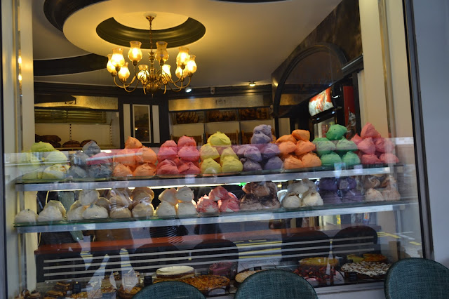 Colourful French meringues in Parisian shop windows