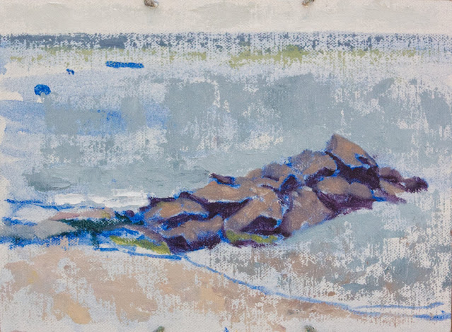 Oil sketch of breakwater made of large rocks, seen against the light