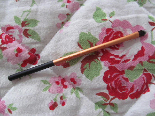 skinny gold pointed makeup brush