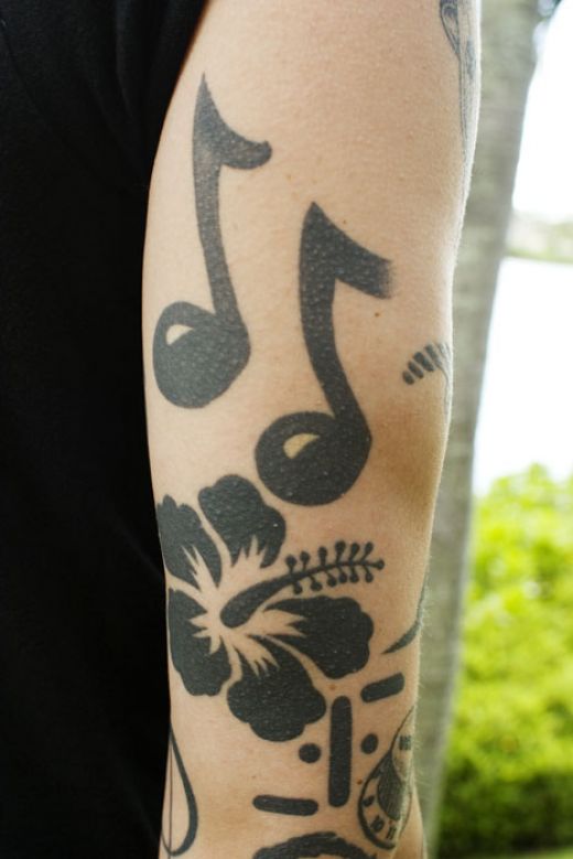 Looking at those two black music note tattoo designs takes me back to 