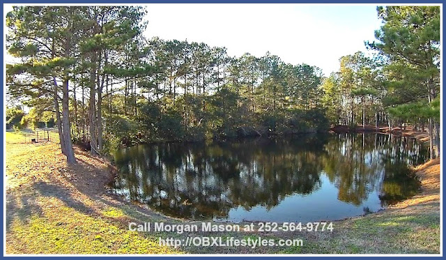 Aside from the 1/2 acre bass stocked pond, this 4 bedroom equestrian property for sale on the Outer Banks NC also features a round corral, three pastures, several steel gates, plug-in fence charger box, 10x30 hurricane rated run in, and solar charger box for emergency pasture. 