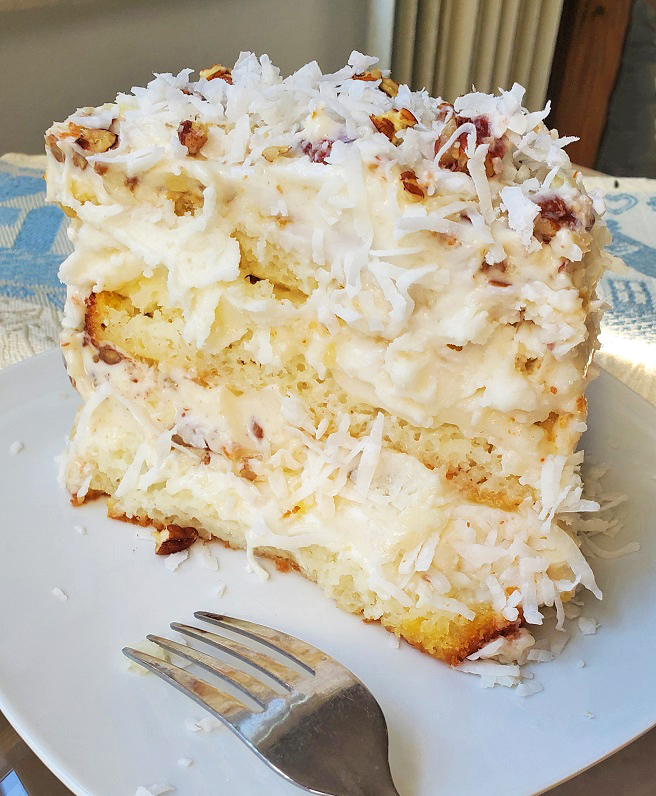 3 layers of coconut pecan white cake with cream cheese frosting
