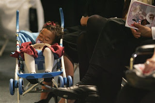 little Jackie Garcia sleeps through her father's funeral