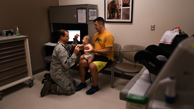 Every year, roughly 8 to 12 percent of the physicians graduating from USU become pediatricians.  Air Force Capt. Meredith Schuldt, USU class of 2011, a pediatrician with the 579th Medical Group at Joint Base Anacostia-Bolling in Washington, DC, conducts a routine checkup with one of her patients in April 2015.  (Photo by Lt.Cmdr. Jim Remington, Joint Base Anacostia-Bolling)