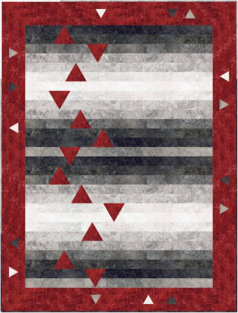 Quilt with black and grey precut strips with inset red accent triangles and a red border with inset triangles.