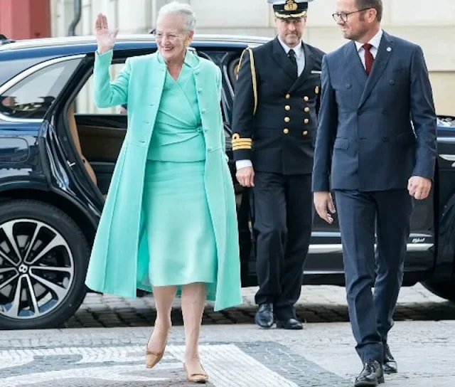 Queen Margrethe designed the Cross Stitch of the Year 2023. Queen Margrethe wore an aquamarine coat, jacket and skirt