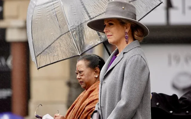 Queen Maxima wore a purple puffled-sleeves dolman midi dress from Victoria Beckham. President Ram Nath Kovind and Savita Kovind