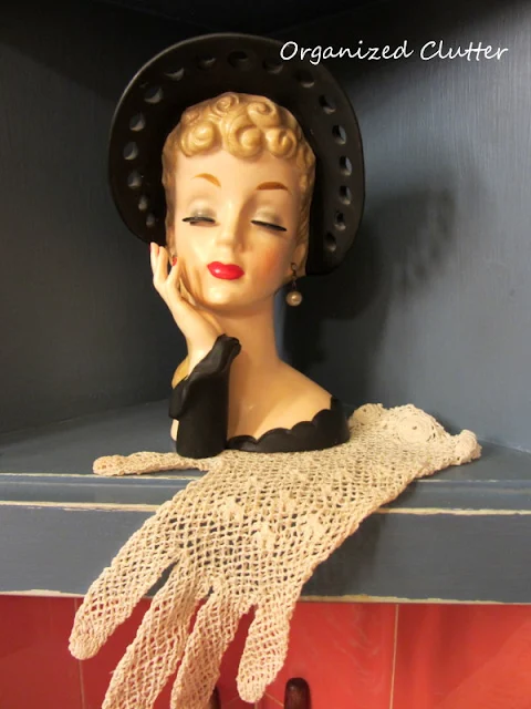 Headvase with glove as a doily