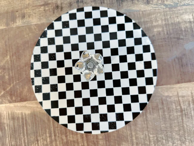 checkerboard tray with gold rim and finial