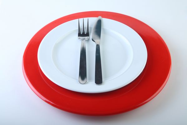 Fork and Knife on White Plates