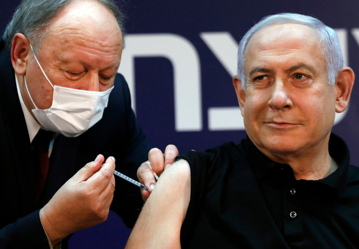 Israeli Prime Minister Benjamin Netanyahu receives the Covid-19 vaccine, starting a national inoculation campaign.