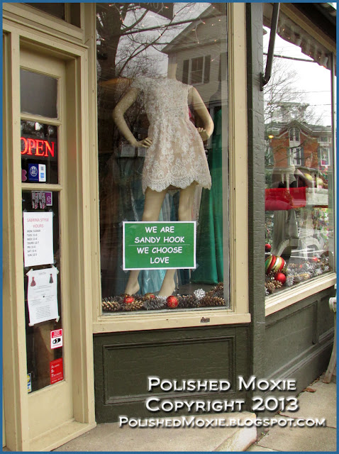 Image of Sandy Hook dress shop with We Choose Love sign.