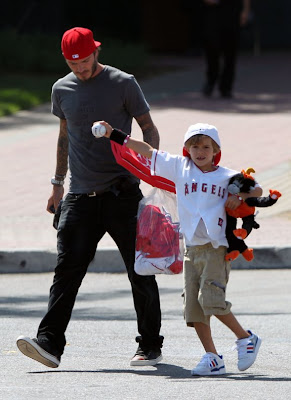 David Beckham and his family playing in the park Pictures