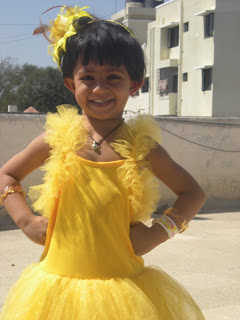 baby doll in yellow frock in the annual day