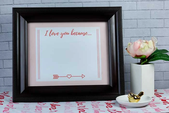 This is an easy Valentine's Day DIY project for home. Use free printables to make an 8x10 frame dry erase sign. Use as decorations or for a gift for him, for her, or for kids. This can be romantic or funny or change it daily. This is a cheap Happy Valentine's Day craft that just needs paper and a cute frame.  Save money with homemade crafts and ideas like this cute sign. #sign #printable #valentinesday