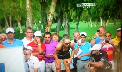 Caroline Wozniacki distracts proceedings at the World Golf Finals