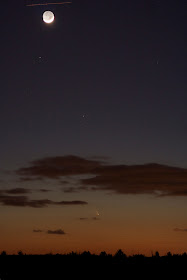 comet panstarrs with moon and plane