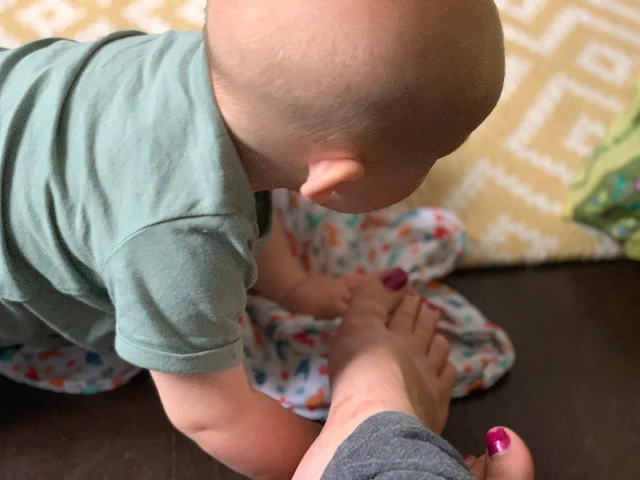 Crawling baby coming to investigate my toes