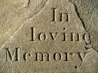 tombstone marking in loving memory
