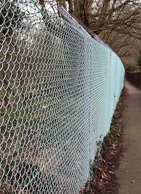 Mesh fence on the Hayes to West Wickham railway path. March 2011.