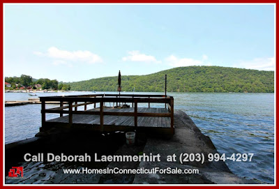 Enjoy easy access to the beach, and delight in the many water activities for your exploration when you live in this gorgeous lakefront home for sale in Candlewood Lake.