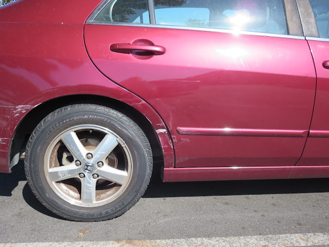 Dents & scrapes on quarter panel & door before repairs at Almost Everything Auto Body