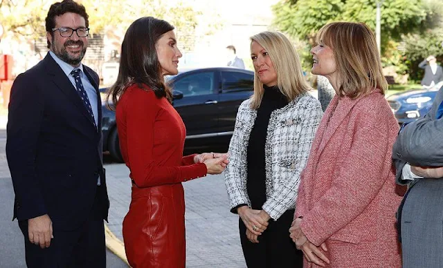 Queen Letizia wore a red frankie cuff detail wool sweater by Hugo Boss. Hugo Boss red leather trousers