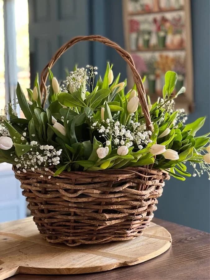 Spring flower arrangement in wicker basket