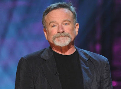 Robin Williams with a sad expression on his face