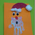 Manualidades para niños: Papá Noel hecho con las huellas de las palmas de la mano