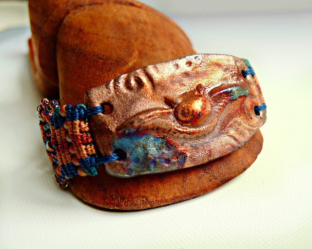 Micro macrame bracelet by Sherri Stokey with raku owl ceramic focal.