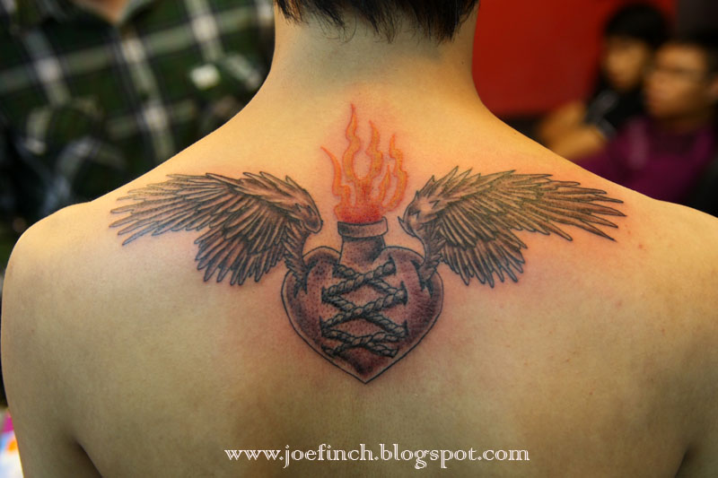 custom sacred heart with wings tattoo