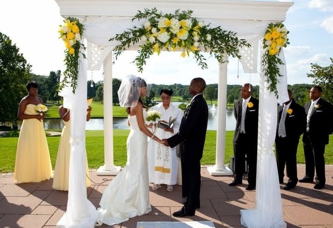 The arbor was draped with chiffon and hanging crystals highlighted with 