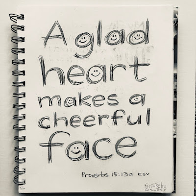 Smiley face lettering Bible verse: A glad heart makes a cheerful face, but by sorrow of heart the spirit is crushed. Proverbs 15:13