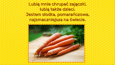 Żółty slajd, na którym znajduje się zagadka o marchwi o treści: Lubią mnie chrupać zajączki, lubią także dzieci. Jestem słodka, pomarańczowa, najsmaczniejsza na świecie. Dodatkowo na slajdzie znajduje się obrazek, przedstawiający pęczek marchwi.