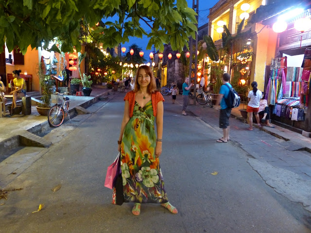 Floral print maxi dress worn with crochet shrug 