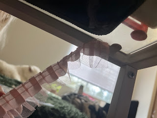 The lace is inserted into the first clip and is hanging down on the other end.