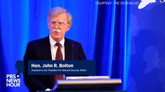 Image Attribute: National Security Adviser John Bolton speaks at a Federalist Society luncheon at the Mayflower Hotel on September 10 in Washington. / Source: YouTube screengrab