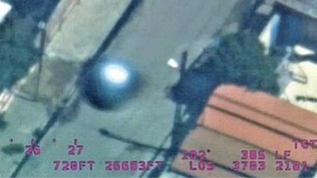 Silver metallic sphere filmed over conflict zone admitted to by the US Government.