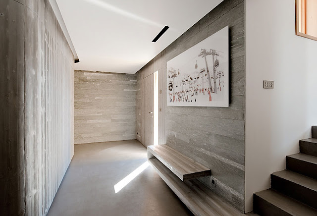 Soft Brown Wall Made from Wooden Material and White Painting Hanged in the Wall