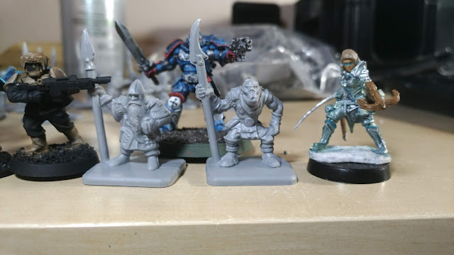 em4 Dwarves and Orcs Miniatures next to WizKid Ranger, 40k Guardsmen