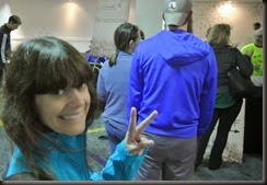 Cheryl stands in Line,   The Guy ahead has an Iowa Leg Cast on his foot!   Was he Going to run?