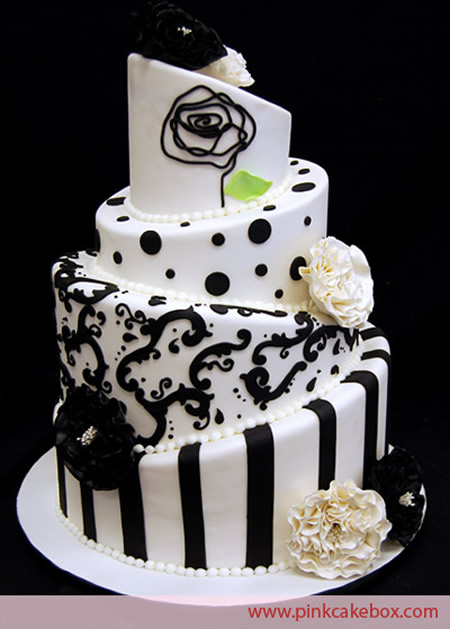 This topsy turvy wedding cake is highlighted with a black and white fantasy