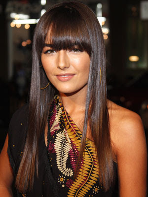 This fringe hairstyle uses a wider, long fringe that is spread over the