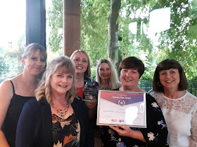 Photograph of the team from Broughton Primary School accepting the Unsung Heroes award at the ceremony on Friday 14 June 2019.