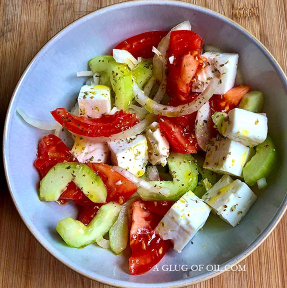 Greek salad in a white bowl