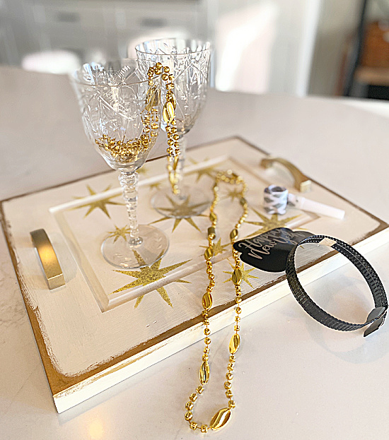 tray, glasses, and new years eve decorations