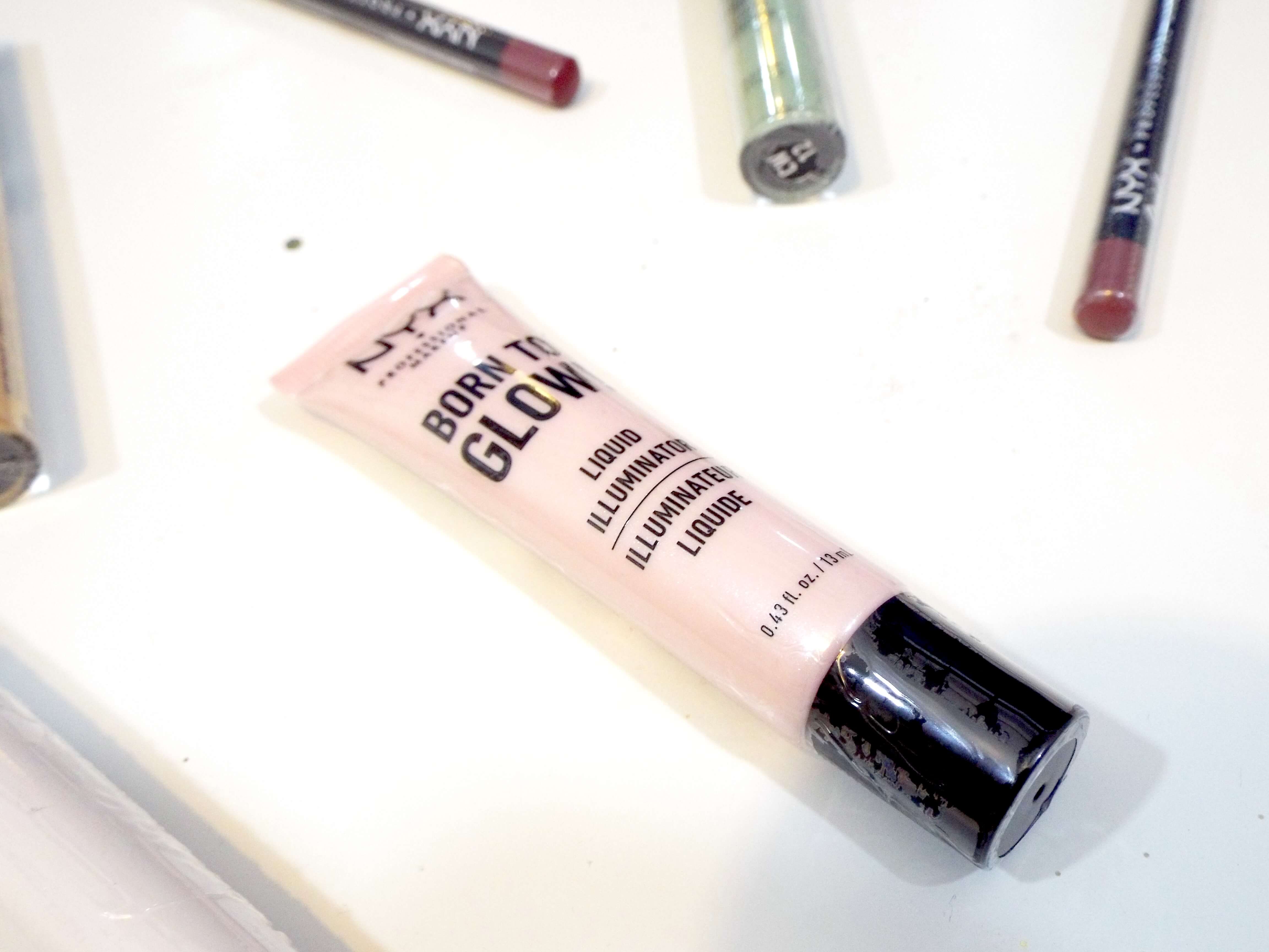 A close up of the NYX Born to Glow Liquid Illuminator in its packaging, in shade sunbeam.