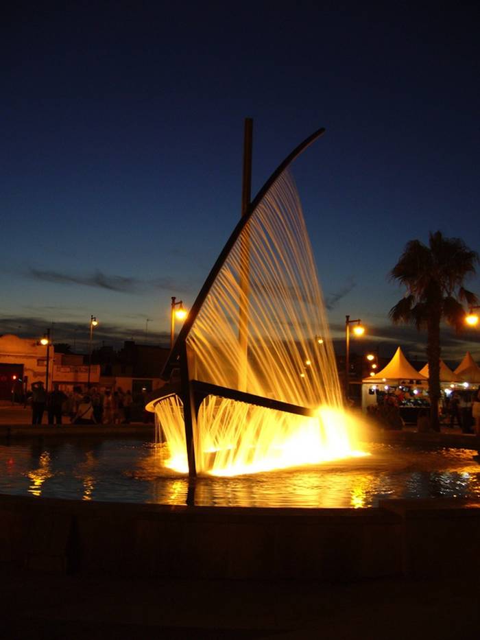 Playa de la Malvarrosa in Valencia, Spain and known simply as Water Boat Fountain (or Fuente del Barco de Agua in Spanish) by visitors and locals alike, the sculptural fountain creates the illusion of both the hull and the sail of a boat with liquid jets.